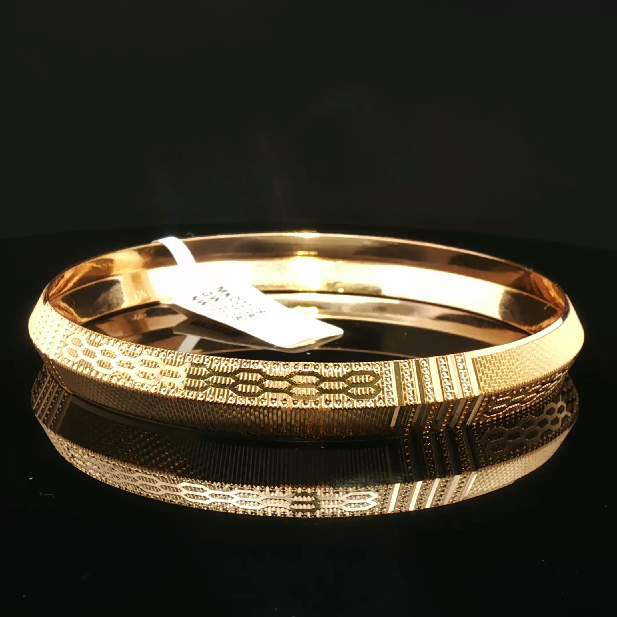 Luxurious Yellow Gold Bangle with Intricate Detailing