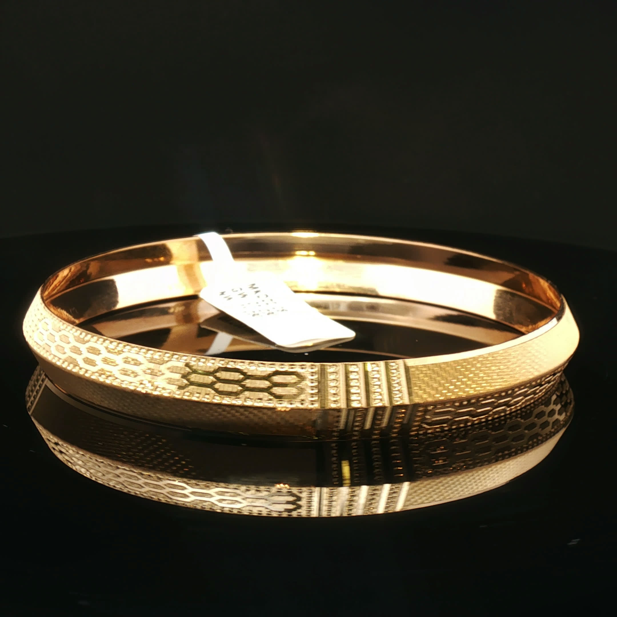 Second image of Luxurious Yellow Gold Bangle with Intricate Detailing
